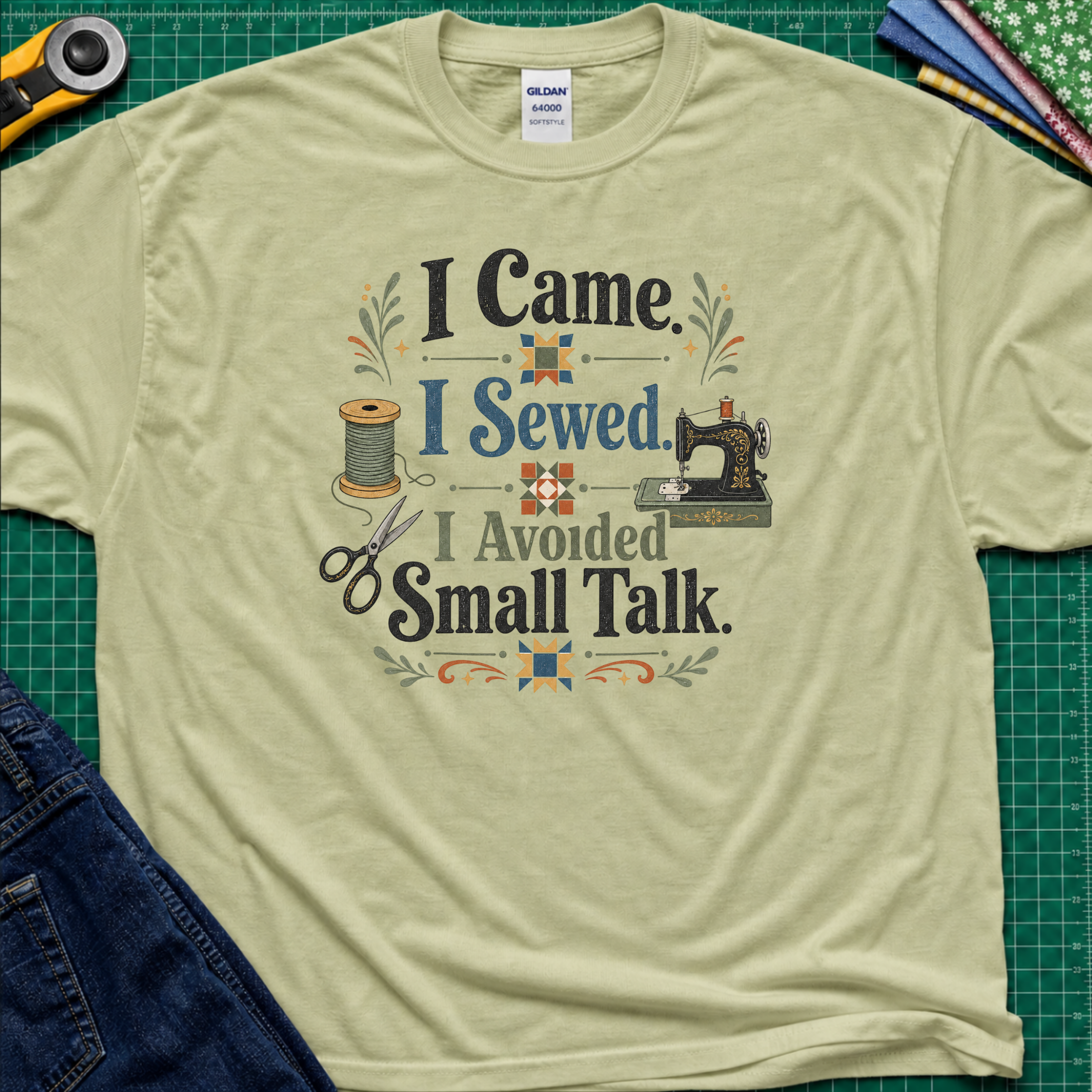 A light green Gildan t-shirt with a retro-style sewing-themed graphic that reads 'I Came I Sewed. I Avoided Small Talk.