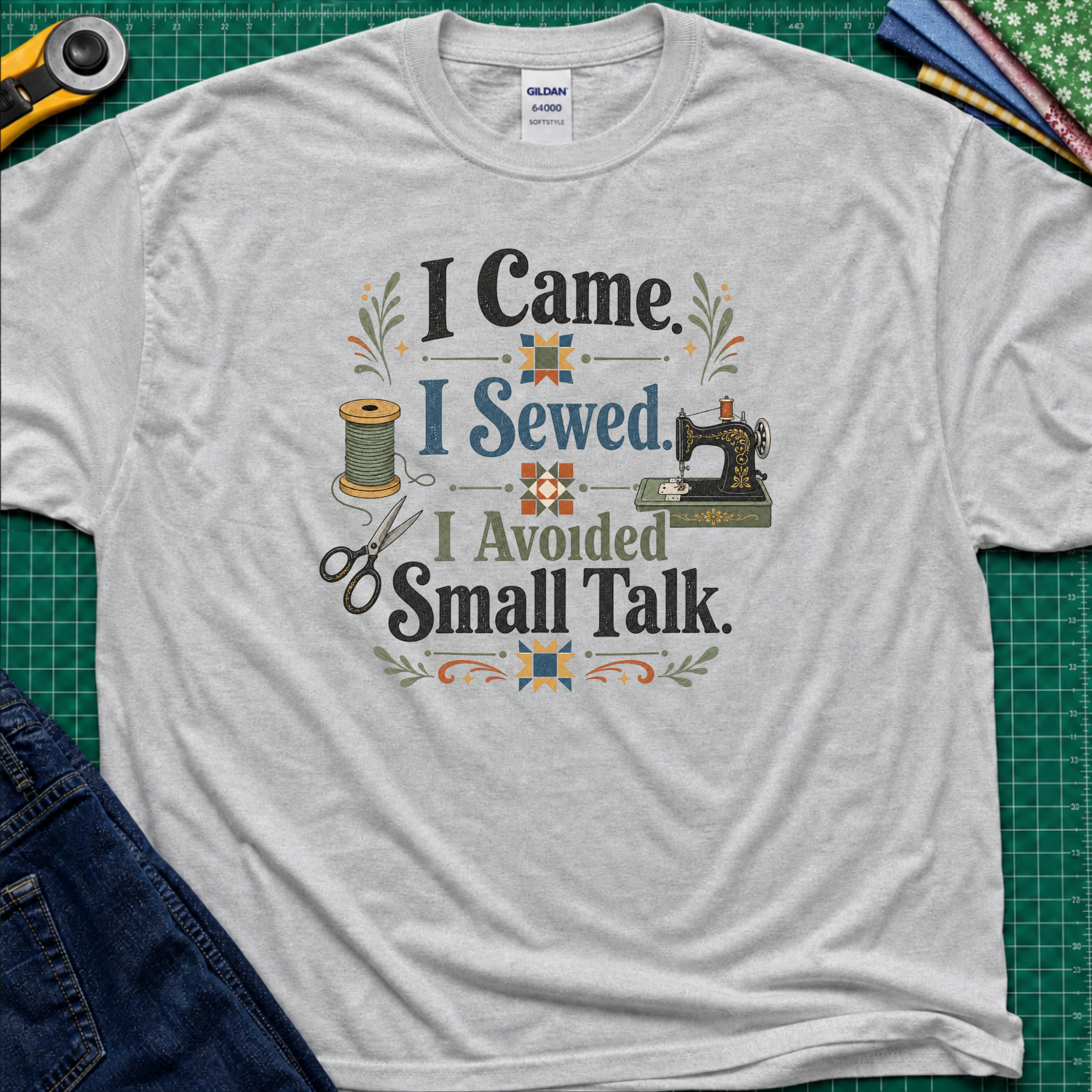 A sport grey Gildan t-shirt with a retro-style sewing-themed graphic that reads 'I Came I Sewed. I Avoided Small Talk.
